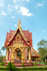 Naklejka premium Golden Chapel at Wat Maha That Wachiramongkol (Wat Bang Thong), Phang Nga, Thailand – Ornate Thai Temple Architecture in Sacred Setting