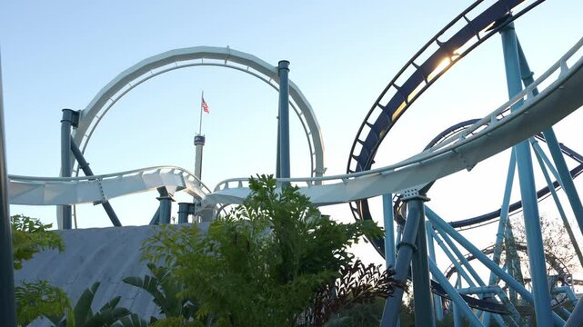 Enjoy stunning roller coasters and exciting marine exhibits while visiting amusement park at sunset. Thrilling rides await every adventurer looking for unforgettable memories.