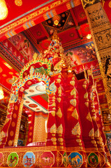 Ornate Interior of Chapel with Gold and Red Design at Wat Maha That Wachiramongkol (Wat Bang Thong), Phang Nga, Thailand &ndash; Traditional Thai Temple Art