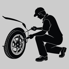 Fototapeta premium a person fixing a car tire silhouette vector design art and illustration