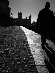 Historic Royal Palace in Backlight with Cobbled Path and silhouette of a Man in Colorno, Parma - Italy