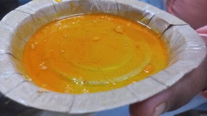Yellow sweet chutney without samosas,sweet samosa Yellow chutneys,sweet samosa yellow chutney in paper plate,
