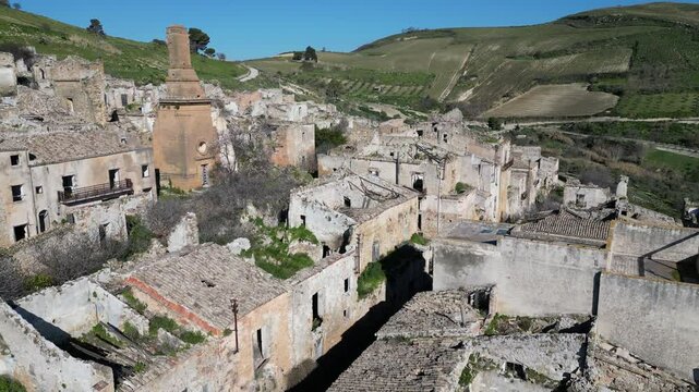 Retreating aerial footage of ruins of Poggioreale, a town in central Sicily that was partly destroyed by the 1968 Belice earthquake in Sicily, Italy
