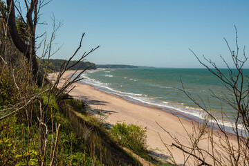 Steep coast of Baltic sea in Jurkalne on a sunny day in May in Latvia