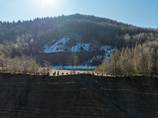 Aerial drone view of Quarry in Kozy an inactive quarry of Lgocka sandstones located on the slope of Chrobacza meadow, within the Magurka Wilkowicka group in Kozy, Polish Beskids.