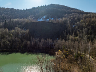Aerial drone view of Quarry in Kozy an inactive quarry of Lgocka sandstones located on the slope of Chrobacza meadow, within the Magurka Wilkowicka group in Kozy, Polish Beskids.