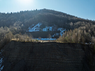 Aerial drone view of Quarry in Kozy an inactive quarry of Lgocka sandstones located on the slope of Chrobacza meadow, within the Magurka Wilkowicka group in Kozy, Polish Beskids.