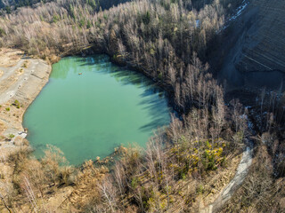 Aerial drone view of Quarry in Kozy an inactive quarry of Lgocka sandstones located on the slope of Chrobacza meadow, within the Magurka Wilkowicka group in Kozy, Polish Beskids.