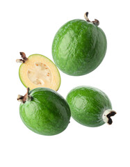 Whole and halved feijoa fruit isolated on black background