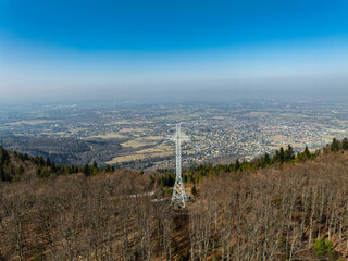Aerial drone view of beskid mountains in spring. Chrobacz Meadow peak in the Magurka Wilkowicka Group in the Little Beskids. Cross on a mountaintop in the Beskids..