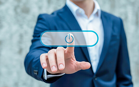 A sleek, professional hand in a navy suit reaches for a glowing teal digital power button, symbolizing modern tech and control in a minimalist interface - Powered by Adobe