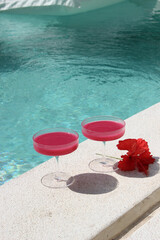 swimming pool with cocktail and flower, dragonfruit juice, hibiscus, cocktailhour, tropic