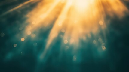 Fototapeta premium Golden Rays: A breathtaking view of sunlight beams cascading through an opaque azure expanse, radiating ethereal warmth and celestial serenity.