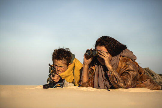 Post-Apocalyptic Woman And Boy Scouting With Binoculars And Rifle - Powered by Adobe