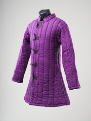 Historical fashion. Medieval knight cloth. Padded jacket gambeson.