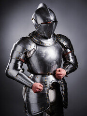 Medieval Knight Wearing Shining Steel Armor Standing in a Heroic Pose..