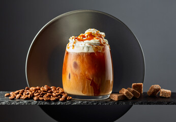 Iced coffee with whipped cream and caramel sauce.