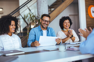 Happy Business Team Collaborating in a Modern Office Environment