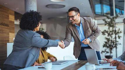 Professionals Greeting Each Other During a Productive Business Meeting in a Modern Office