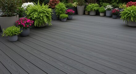 Grey Composite Deck with Blooming Plants - Serene outdoor space featuring a grey composite deck, surrounded by lush potted plants and vibrant flowers. Symbolizes tranquility, growth, beauty
