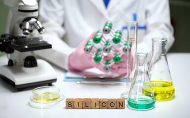 A detailed lab scene with a silicon model, beakers, and a microscope for scientific research and...