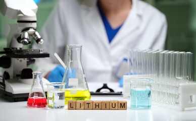 Fototapeta premium A skilled scientist analyzes lithium in a lab, showcasing glassware and tools for precise measurements