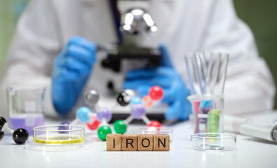 This scientific research setup includes elements such as iron, molecular structures, and assorted...