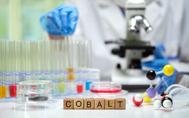 Fototapeta premium A glimpse into a laboratory focused on cobalt, featuring test tubes, a microscope, and molecular models.