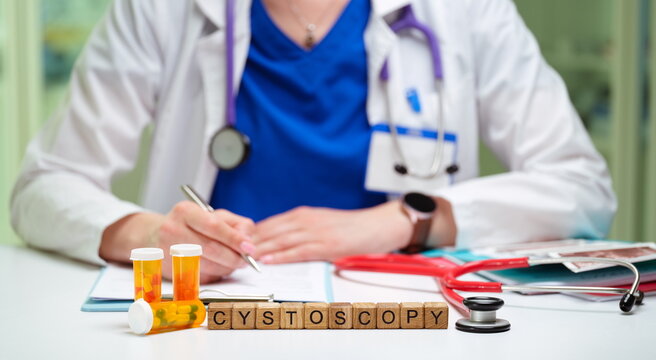 A healthcare provider is preparing for a cystoscopy examination with medical supplies organized on the table