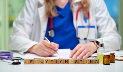 A skilled doctor is ready to effectively treat a jellyfish sting, showcasing necessary tools and medical expertise