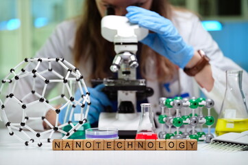 A researcher examines samples under a microscope, showcasing advancements in the exciting field of...