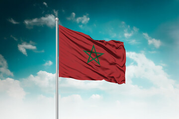 High-resolution stock image of a gently billowing Morocco national flag mounted on a modern...