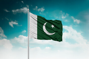 High-resolution stock image of a gently billowing Pakistan national flag mounted on a modern flagpole against a dramatic sky backdrop, symbolizing unity, patriotism, and global connection.