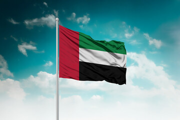 High-resolution stock image of a gently billowing United Arab Emirates national flag mounted on a...