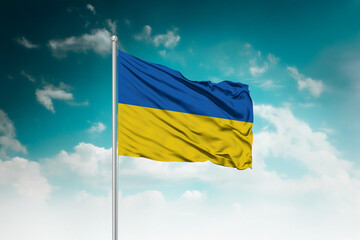 High-resolution stock image of a gently billowing Ukraine national flag mounted on a modern...