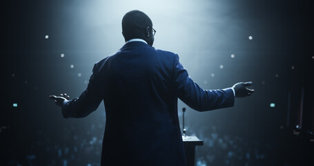 Visionary African Leader Speaking at a Global Economic Strategies at International Business Conference. Public Speaker Sharing Professional Knowledge and Leadership Insights to the Guests in the Room