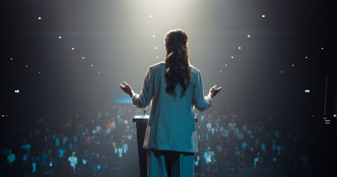 Visionary Female Leader Speaking at a Global Economic Strategies at International Business Conference. Public Speaker Sharing Professional Knowledge and Leadership Insights to the Guests in the Room