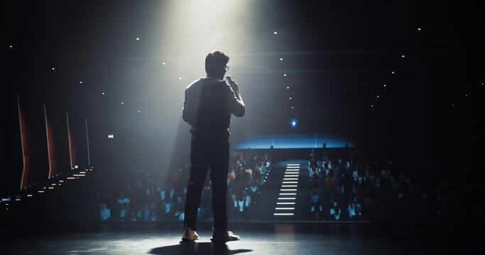 Indian Startup Founder Speaking at a Global Economic Strategies at International Business Conference. Public Speaker Sharing Professional Knowledge and Leadership Insights. Image from Behind