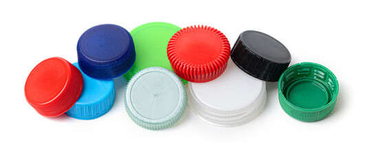 Colorful plastic bottle caps forming a pattern on white background