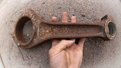 Rusty Connecting Rod in Hand: Old Engine Part