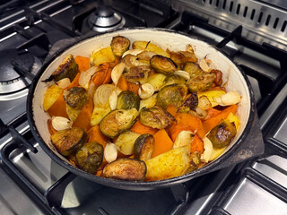 Oven-Roasted Vegetables: Brussels Sprouts, Pumpkin, Potatoes, Carrots, and Garlic in Cast Iron....