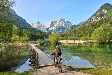 active senior woman on a mountain bike tour at Lake Jezero Jasna in the Triglav National Park near Kranska Gora, Julian Alps, Slovenia  © Uwe