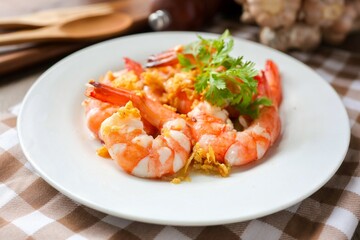 Stir Fried Shrimps with Garlic on white ceramic plate, home cook