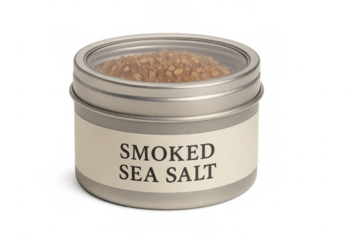 Smoked sea salt in round metal tin with transparent lid on transparent background
