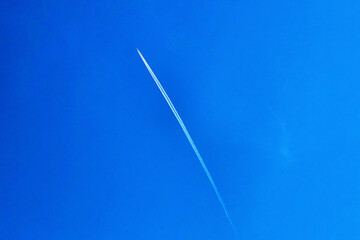 Airplane trace on a clear blue sky