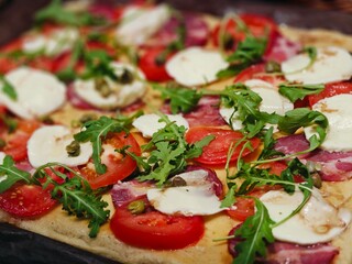 pizza with cheese and vegetables