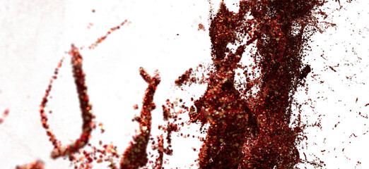 Red and gold glitter explosion on white background. Perfect for festive designs, cosmetics, and more.