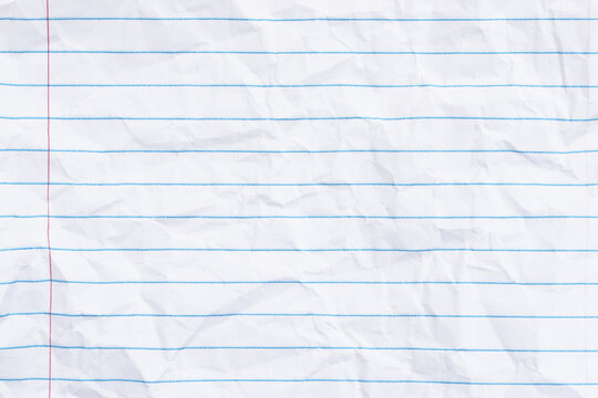 Crumbled lined loose leaf notebook paper background