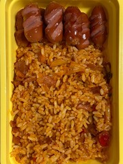 A traditional Korean dosirak, beautifully arranged with rice, assorted banchan, and savory proteins. Balanced and visually inviting, it’s a portable meal packed with vibrant flavors.