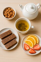 Overhead shot of tea, almonds, protein bars, oranges, and strawberries